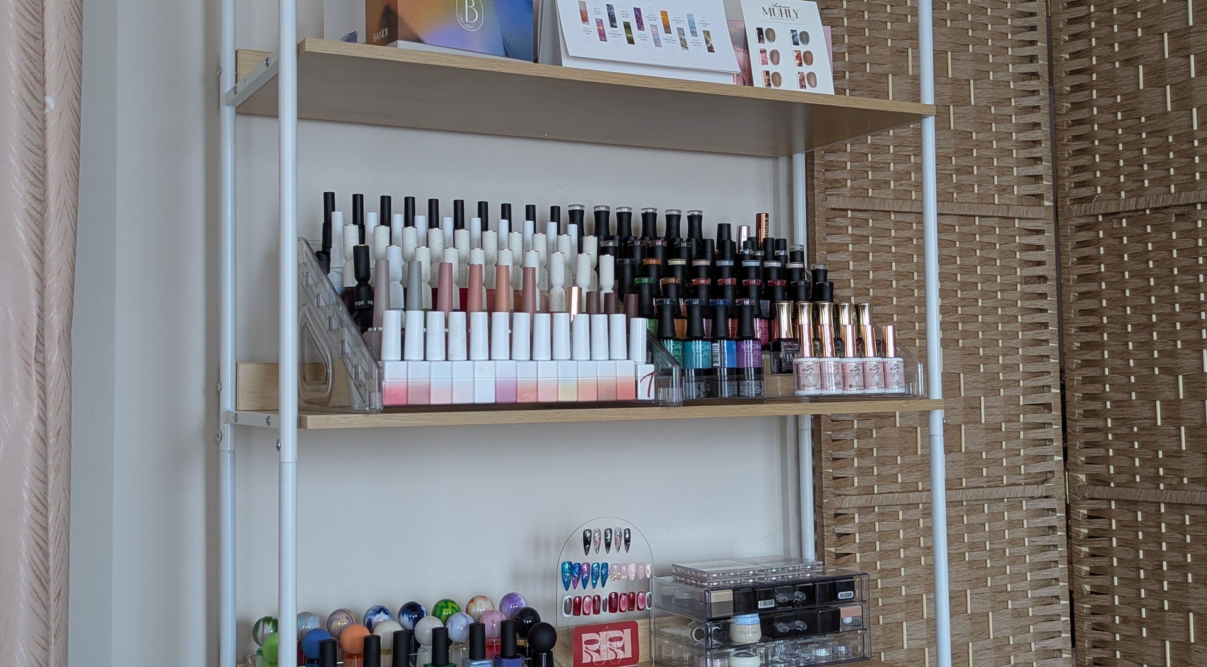 Colorful nail polish display at The Nail Aangan in Narre Warren South, Victoria, AU showcases variety.