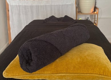 Massage table setup at Slow Down, Brighton And Hove, England, GB offering a calming ambiance.