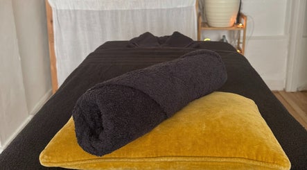 Massage table setup at Slow Down, Brighton And Hove, England, GB offering a calming ambiance.