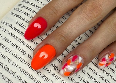 Colorful nail art on hand showcased at ZInailSTUDIO, Milton Keynes, England, GB.