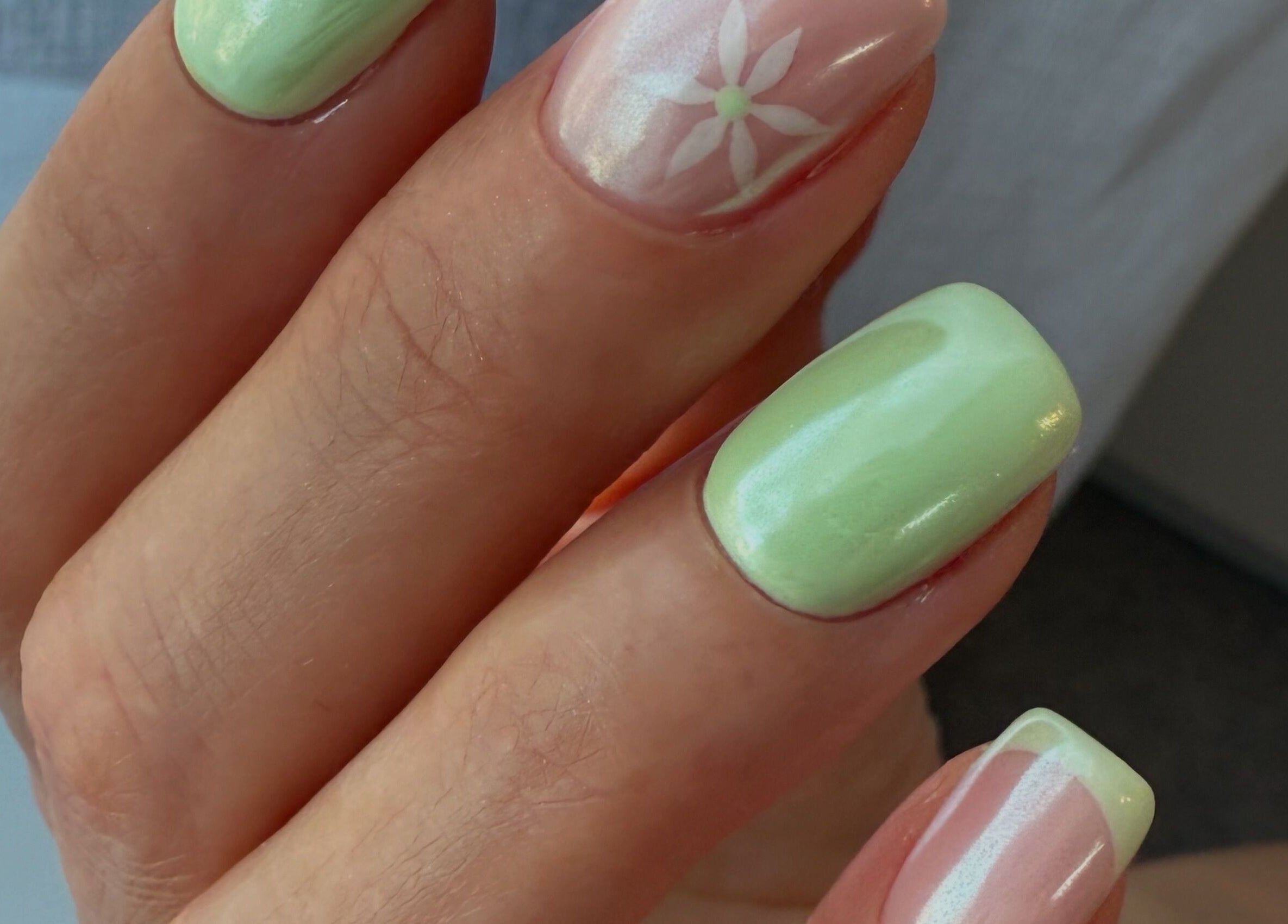 Elegant mint green nails with floral design at ZInailSTUDIO, Milton Keynes, England, GB.