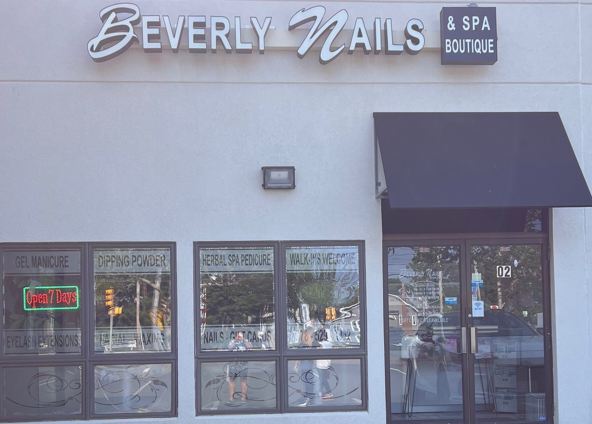 Facade of Beverly Nails and Spa Boutique in Beverly, Massachusetts, US featuring signage and welcoming windows.