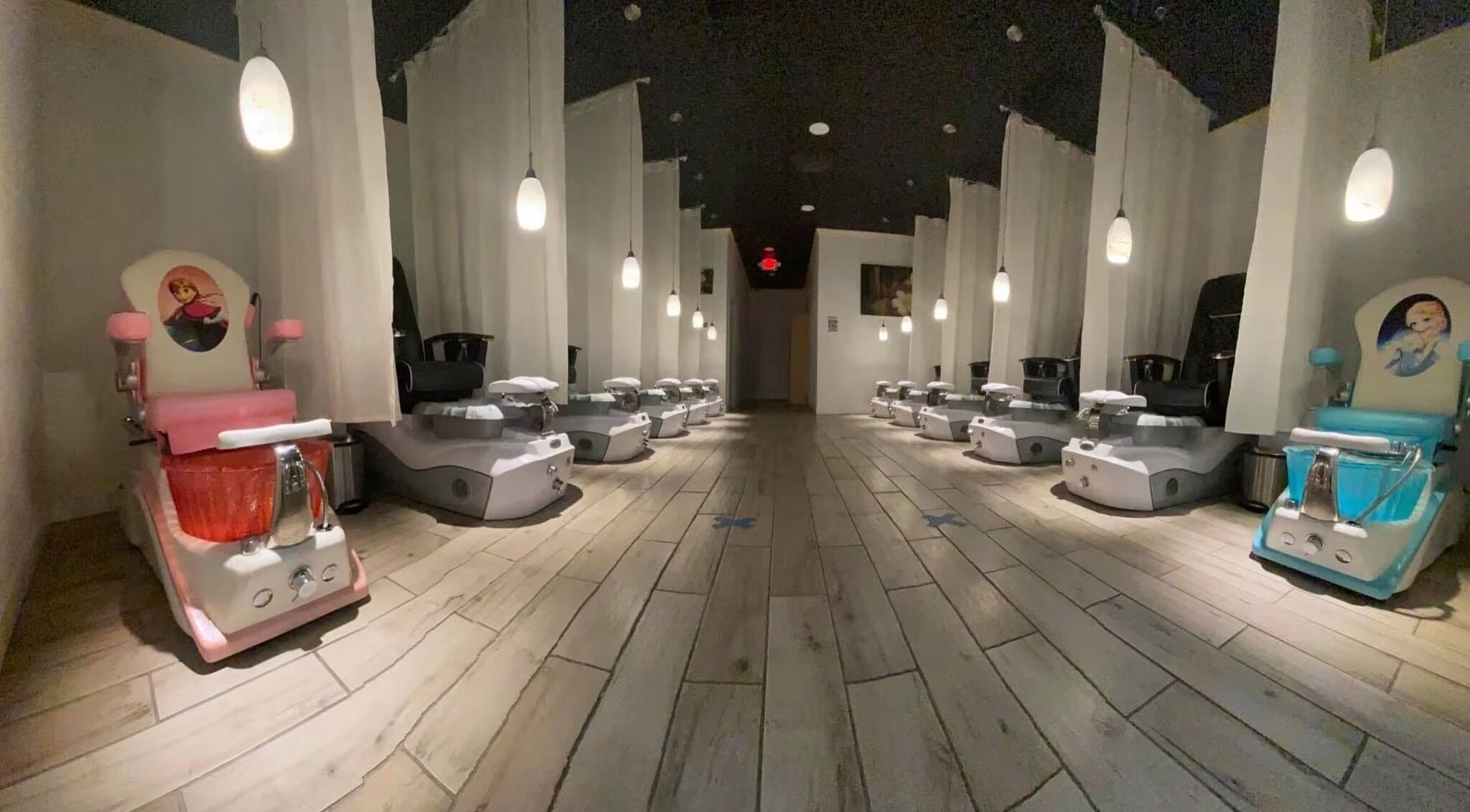 Luxurious pedicure chairs at Beverly Nails and Spa Boutique in Beverly, Massachusetts, US, under soft lighting.