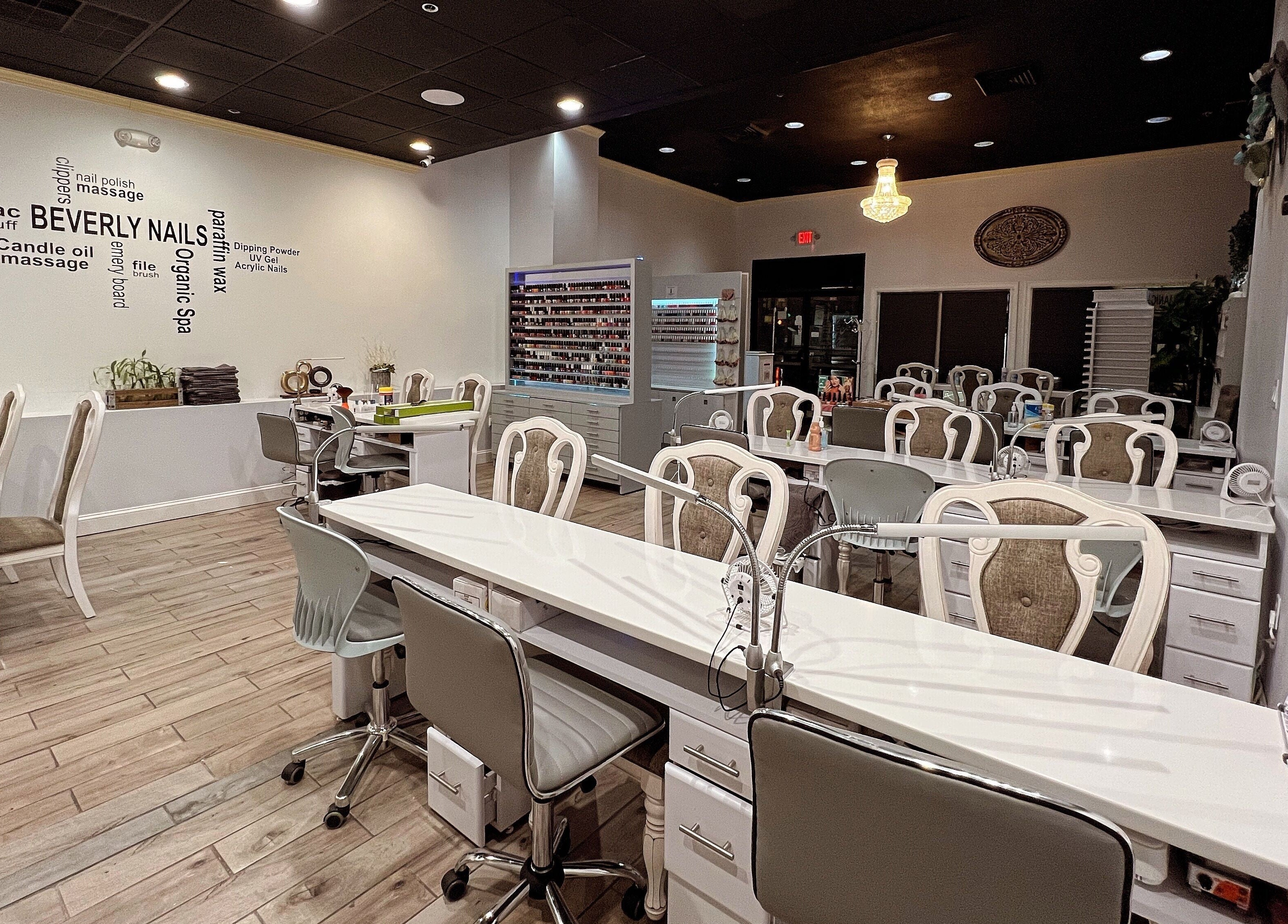 Elegant nail salon interior at Beverly Nails and Spa Boutique in Beverly, Massachusetts, US, showcasing manicure stations.