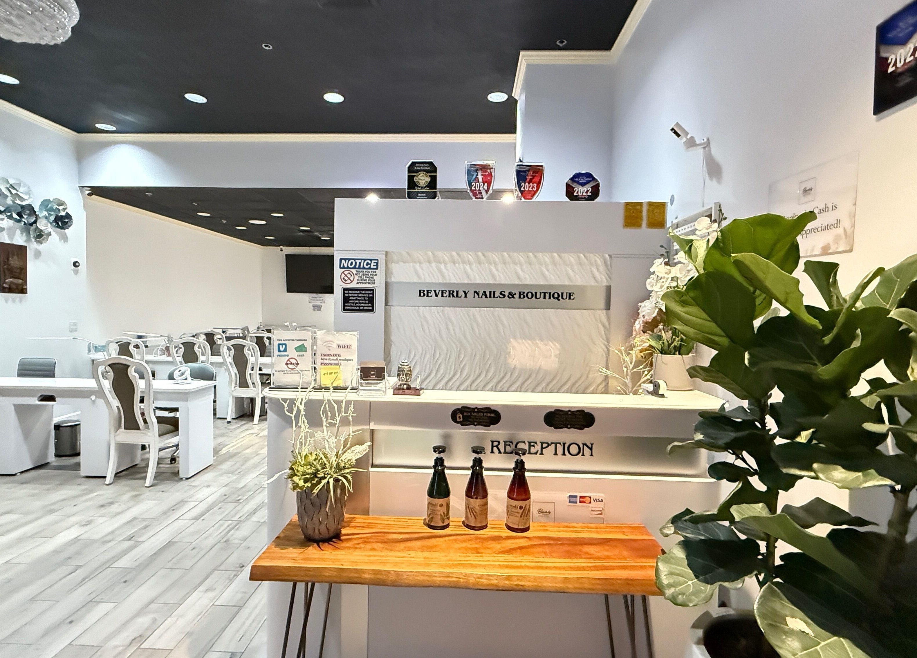 Reception area of Beverly Nails and Spa Boutique in Beverly, Massachusetts, US, showcasing modern decor.