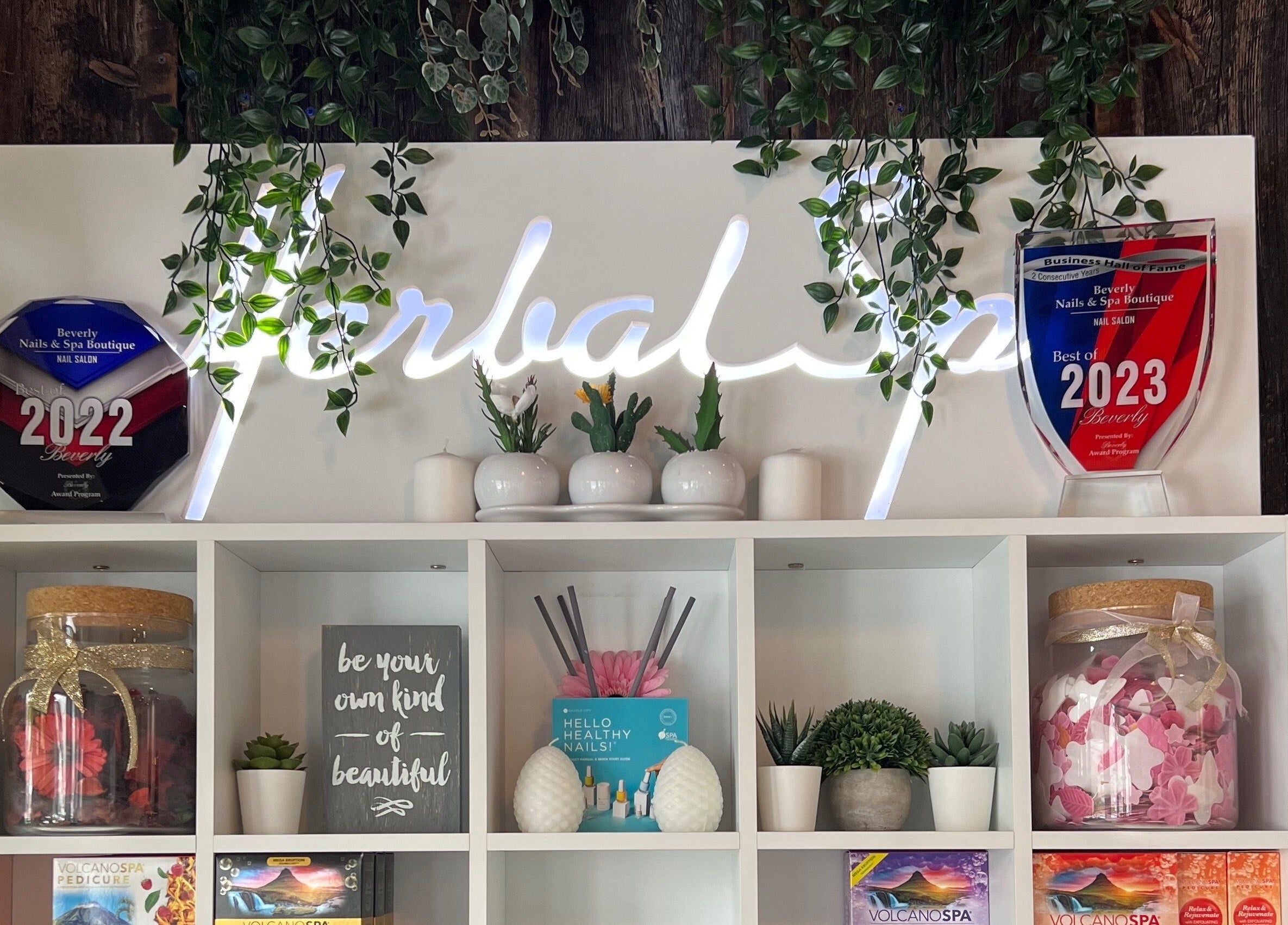 Elegant award display at Beverly Nails and Spa Boutique, Beverly, Massachusetts, US enhances salon's interior.