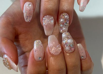 Elegant, glittering nail art at Naily Atelier, West Ryde, New South Wales, AU, showcasing intricate design details.