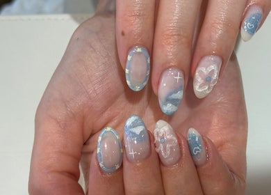Intricate floral nail art at Naily Atelier, West Ryde, New South Wales, AU showcasing detailed blue and white designs.