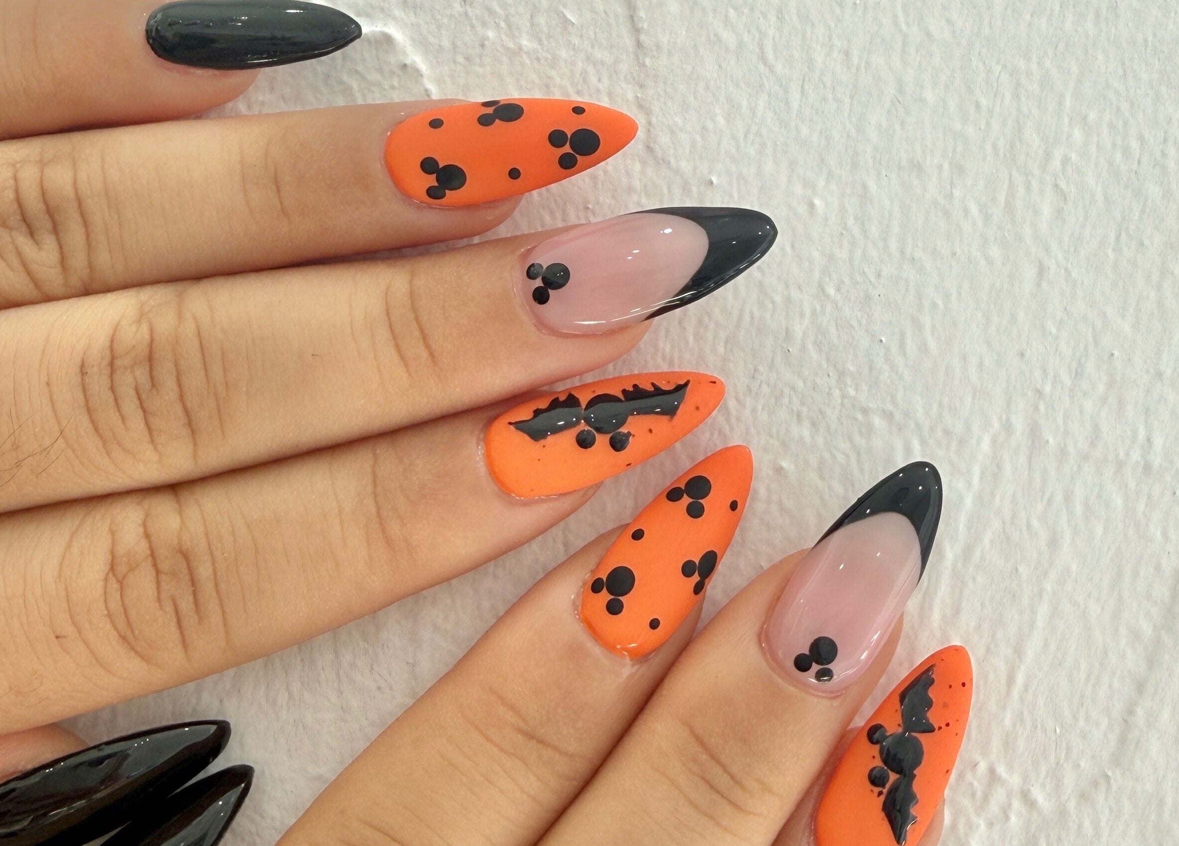 Halloween-themed nail art at Naily Atelier, West Ryde, New South Wales, AU with black and orange designs.