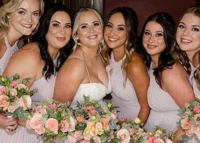 Bridesmaids with bouquets at Charlotte Jennifer Makeup & Wellness, Gravesend, England, GB.