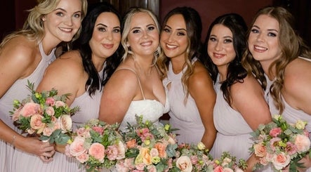 Bridesmaids with bouquets at Charlotte Jennifer Makeup & Wellness, Gravesend, England, GB.