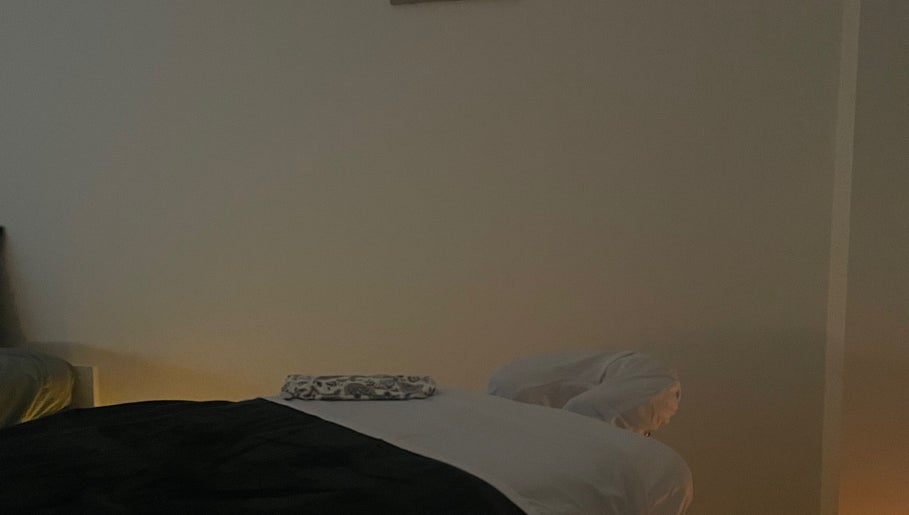 Calm massage room at Massage therapies by Jess, Chippenham, England, GB, with a softly lit massage table.