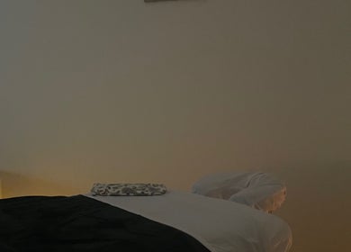 Calm massage room at Massage therapies by Jess, Chippenham, England, GB, with a softly lit massage table.