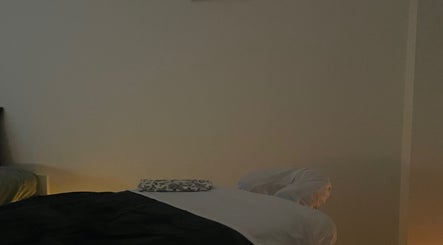Calm massage room at Massage therapies by Jess, Chippenham, England, GB, with a softly lit massage table.