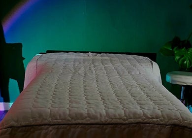Tranquil massage room at Healing Touch, Belfast, Northern Ireland, GB, featuring a comfy bed and calming decor.