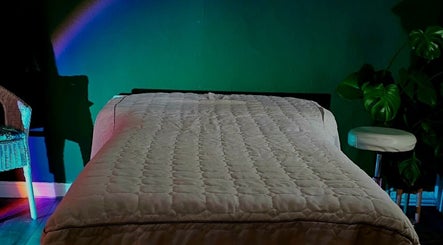 Tranquil massage room at Healing Touch, Belfast, Northern Ireland, GB, featuring a comfy bed and calming decor.