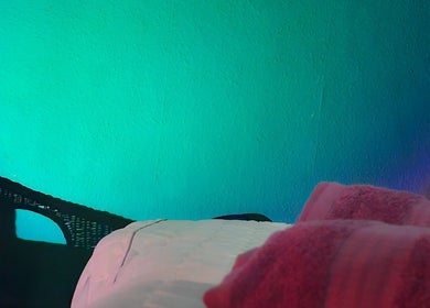 Healing Touch spa room with a cozy bed and calming lights, Belfast, Northern Ireland, GB.