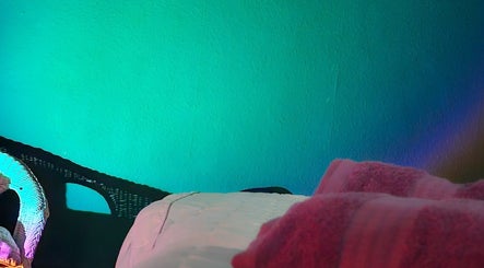 Healing Touch spa room with a cozy bed and calming lights, Belfast, Northern Ireland, GB.