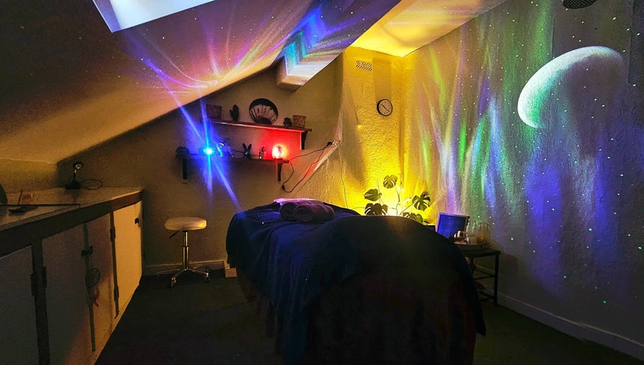 Relaxing ambient room at Healing Touch, Belfast, Northern Ireland, GB with colorful cosmic lights.