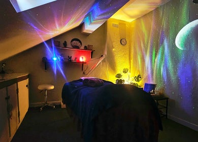 Relaxing ambient room at Healing Touch, Belfast, Northern Ireland, GB with colorful cosmic lights.