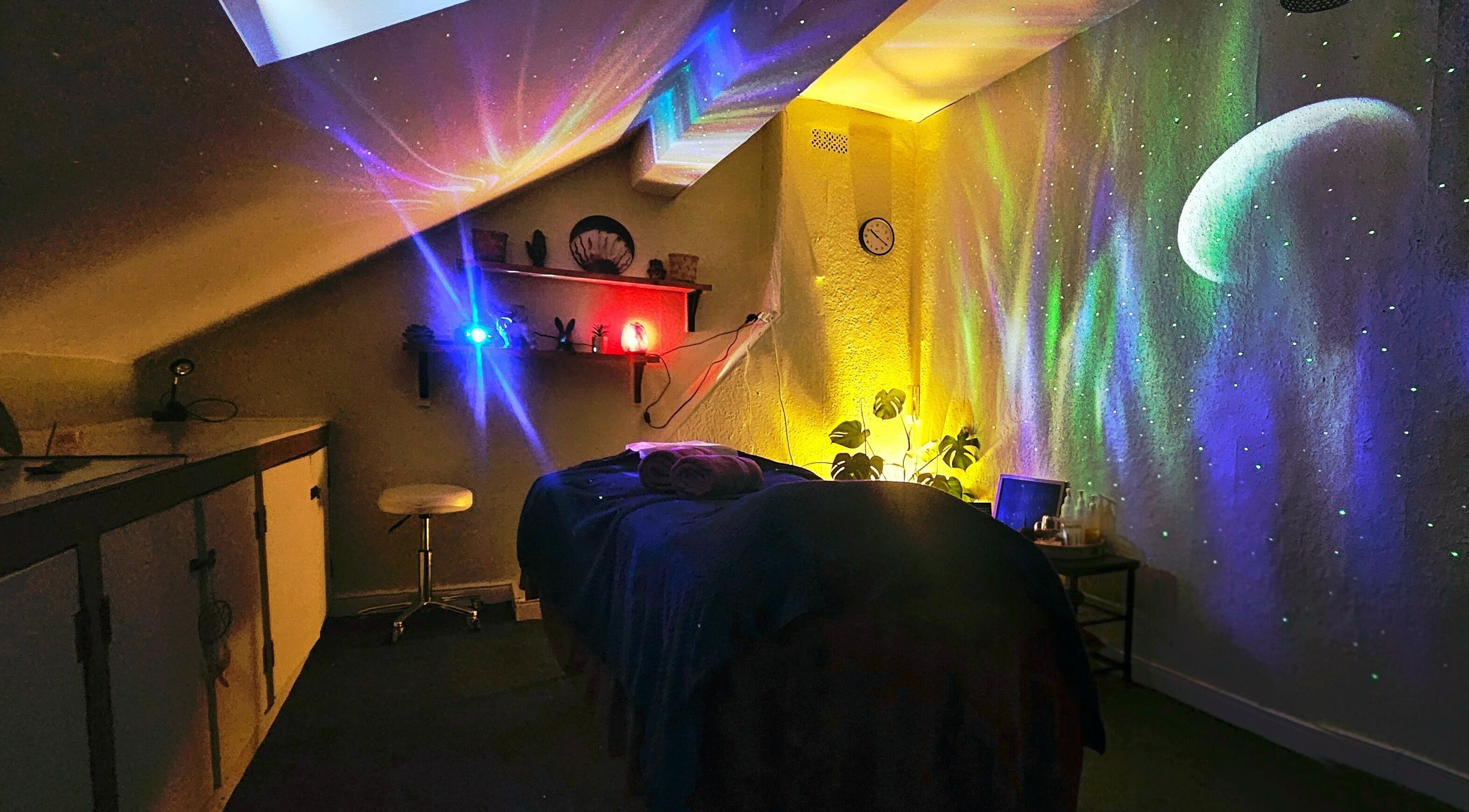 Relaxing ambient room at Healing Touch, Belfast, Northern Ireland, GB with colorful cosmic lights.