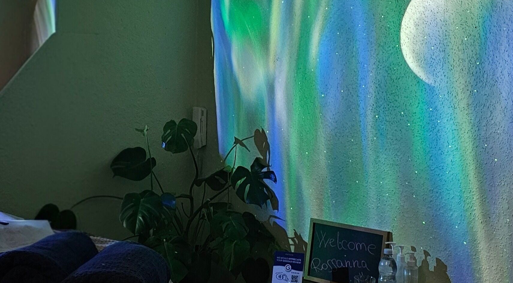 Serene therapy room at Healing Touch, Belfast, Northern Ireland, GB with calming lights and plants.