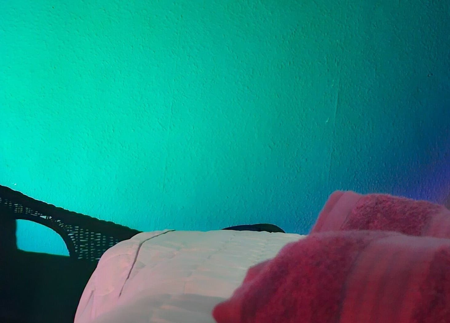 Cozy massage room at Healing Touch, Belfast, Northern Ireland, GB with soft lighting and plush linens.