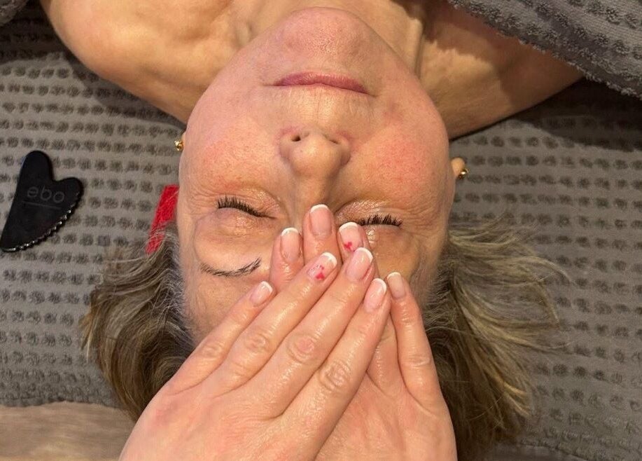 Facial massage at Lorna Dorrington Beauty in Fordingbridge, England, GB, promoting relaxation and rejuvenation.