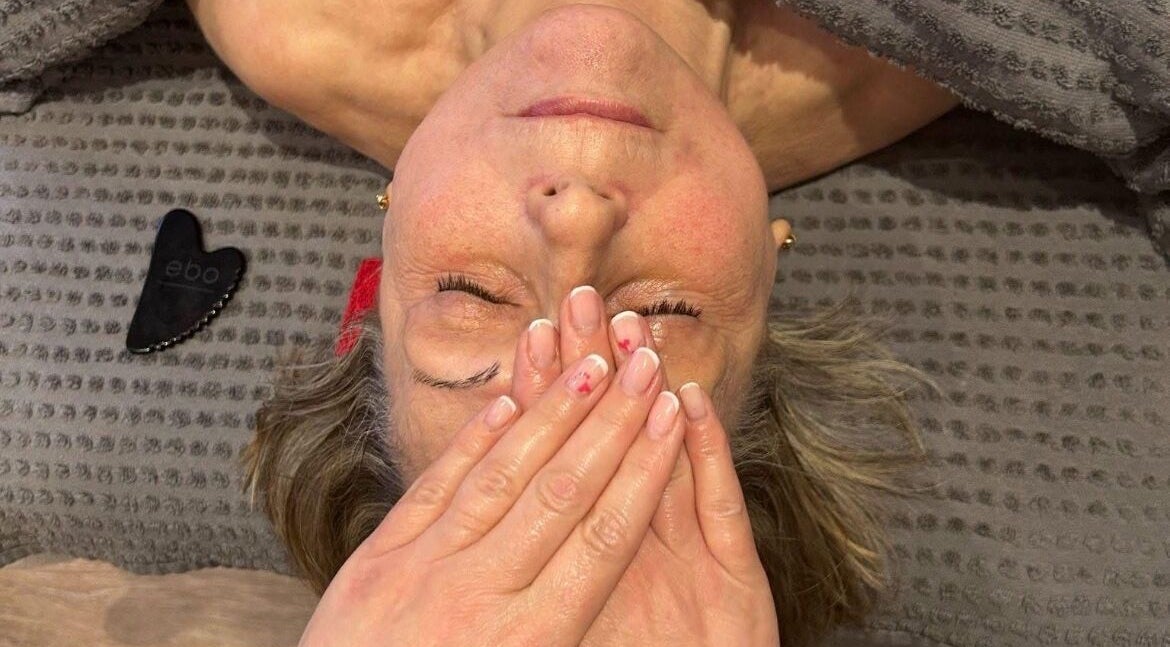 Facial massage at Lorna Dorrington Beauty in Fordingbridge, England, GB, promoting relaxation and rejuvenation.