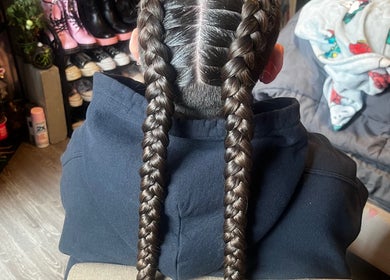Two neatly braided hair strands at triptoogoated in Woodbridge Township, New Jersey, US.