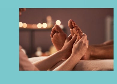 Relaxing foot massage at Azure Wellness, Combe Martin, England, GB, offering soothing wellness experiences.