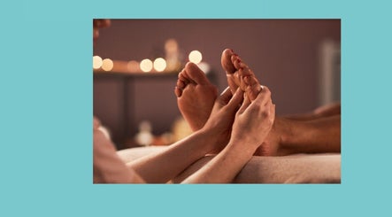 Relaxing foot massage at Azure Wellness, Combe Martin, England, GB, offering soothing wellness experiences.
