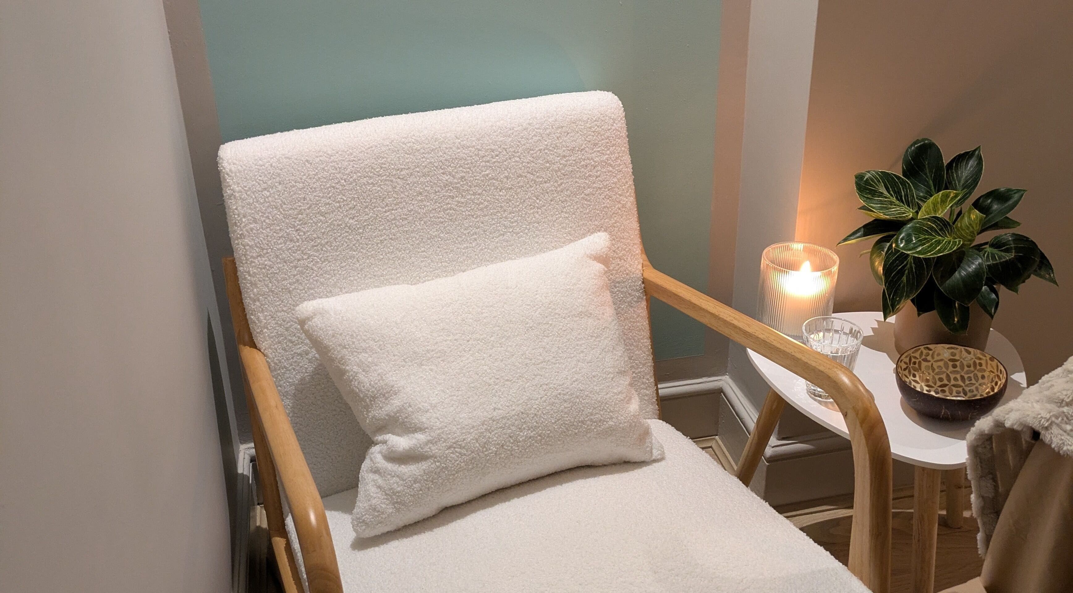 Relaxing chair with candle and plant at Azure Wellness, Combe Martin, England, GB.