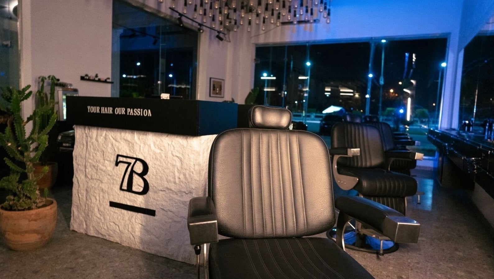Stylish salon chairs and modern decor at HANOSA, Ismailia Governorate, EG. Ideal for luxury beauty services.