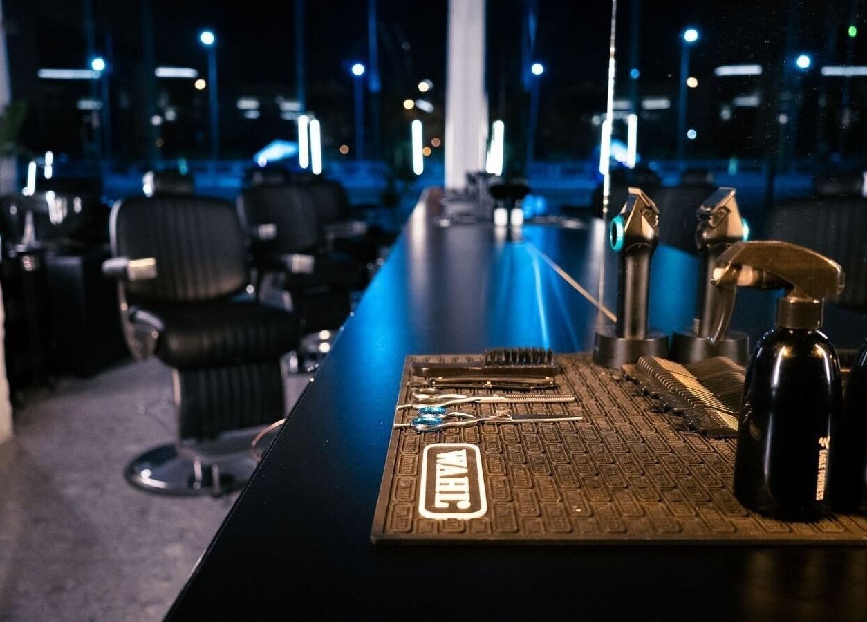 Modern salon interior at HANOSA in Ismailia Governorate, Egypt featuring sleek barber chairs and grooming tools.