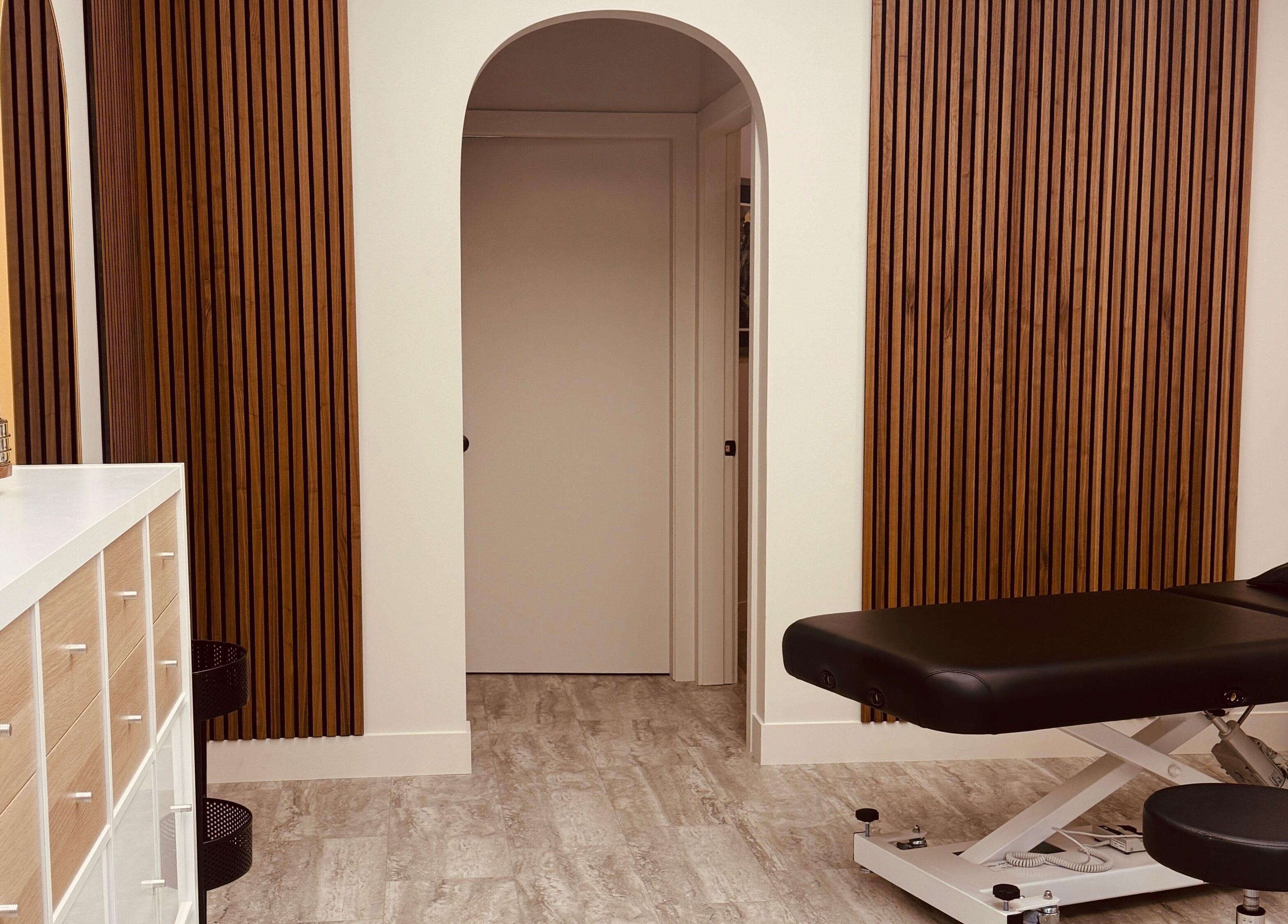 Modern treatment room at Jessie Grant - Ember Studio in Kelowna, British Columbia, CA with elegant wooden design.