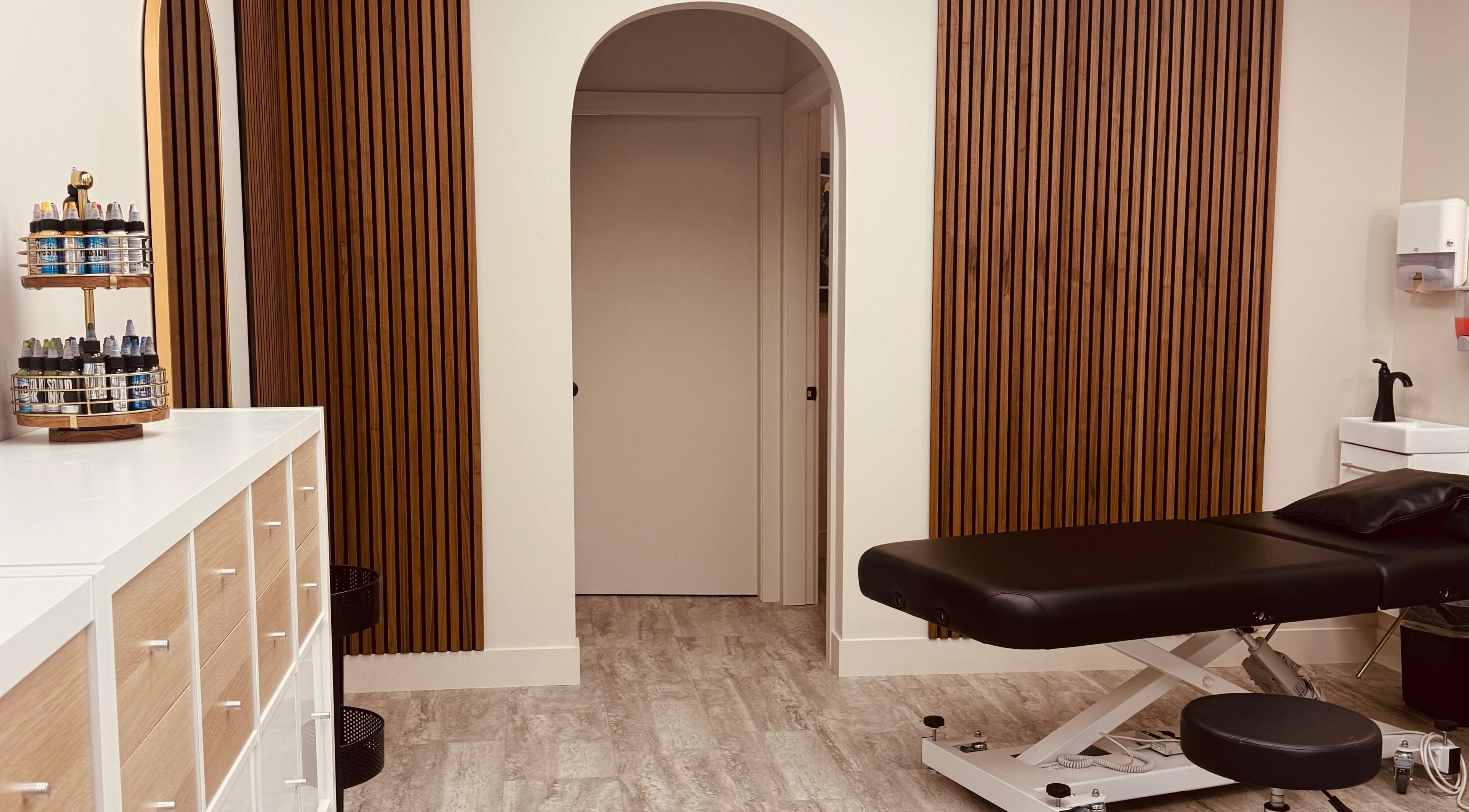 Modern treatment room at Jessie Grant - Ember Studio in Kelowna, British Columbia, CA with elegant wooden design.