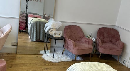 Pink velvet chairs and elegant decor at The Fairy Eyelashes, London, England, GB.