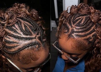 Intricate braided hairstyle at Shegostyless, Boston, Massachusetts, US, showcasing detailed cornrow patterns.