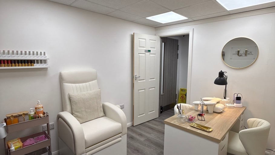 Chic nail salon interior at By Lucy Jane in Bognor Regis, England, GB with cozy seating and organized workstations.