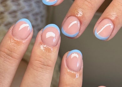 Elegant blue-tipped manicure by By Lucy Jane in Bognor Regis, England, GB showcasing nail art expertise.