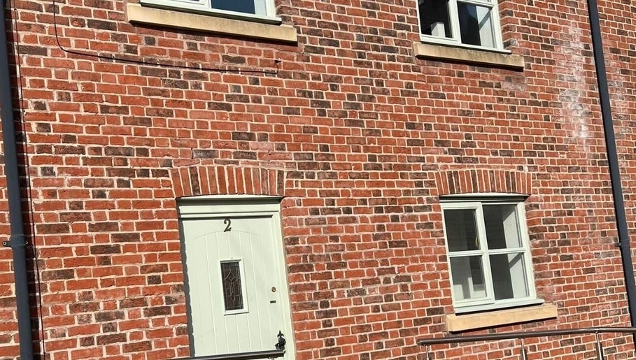 Front view of Sculpt & Pout SPMU with a classic brick facade in Congleton, England, GB.