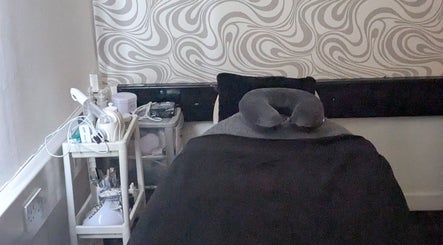 Elegant treatment room at F.A.B by Louise, Cambuslang, Scotland, GB with modern decor and spa essentials.