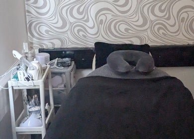 Treatment room at F.A.B by Louise, Cambuslang, Scotland, GB, featuring a cozy massage bed and elegant decor.