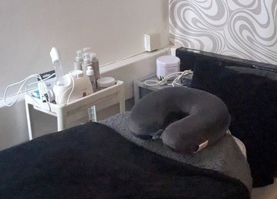 Relaxing treatment room at F.A.B by Louise, Cambuslang, Scotland, GB, featuring massage bed and skincare tools.
