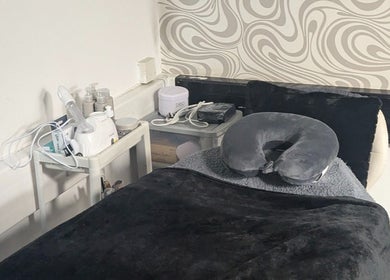Relaxing treatment room at F.A.B by Louise, Cambuslang, Scotland, GB featuring a comfy massage bed.