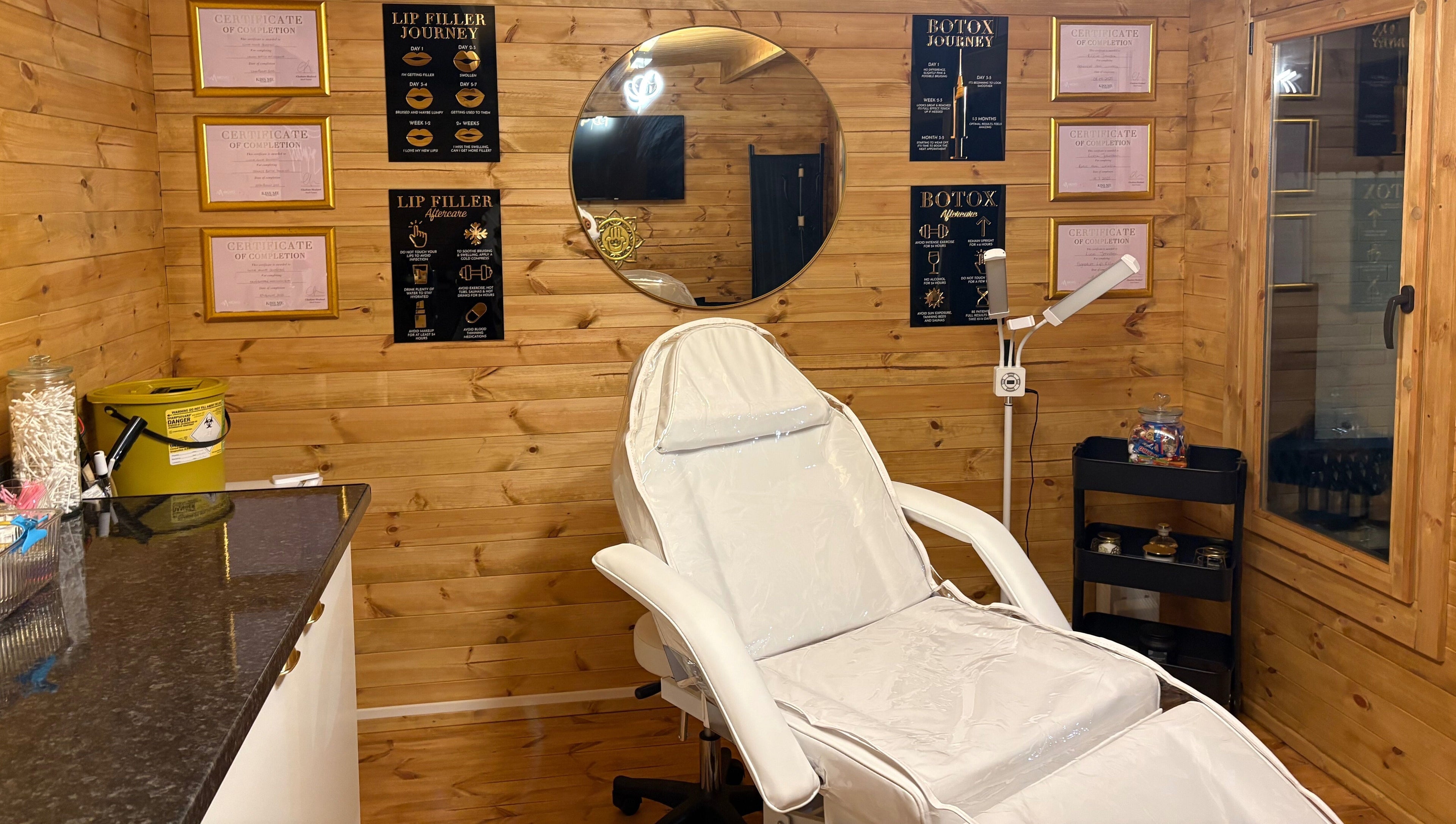 Relaxing treatment room at Cabin Cosmetics, Verwood, England, GB with chair and wooden interior decor.