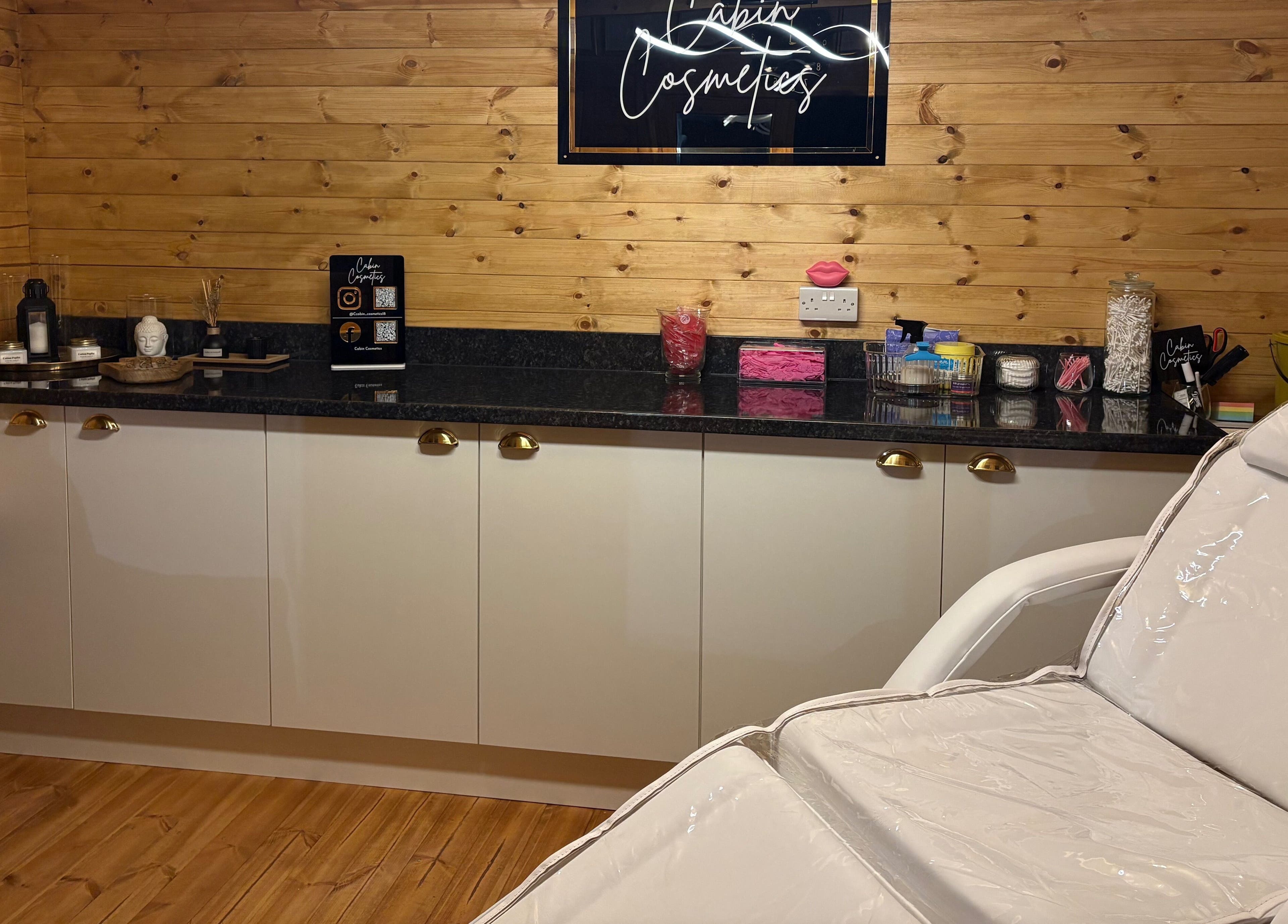Cozy interior of Cabin Cosmetics in Verwood, England, GB showcasing a relaxing beauty treatment room.