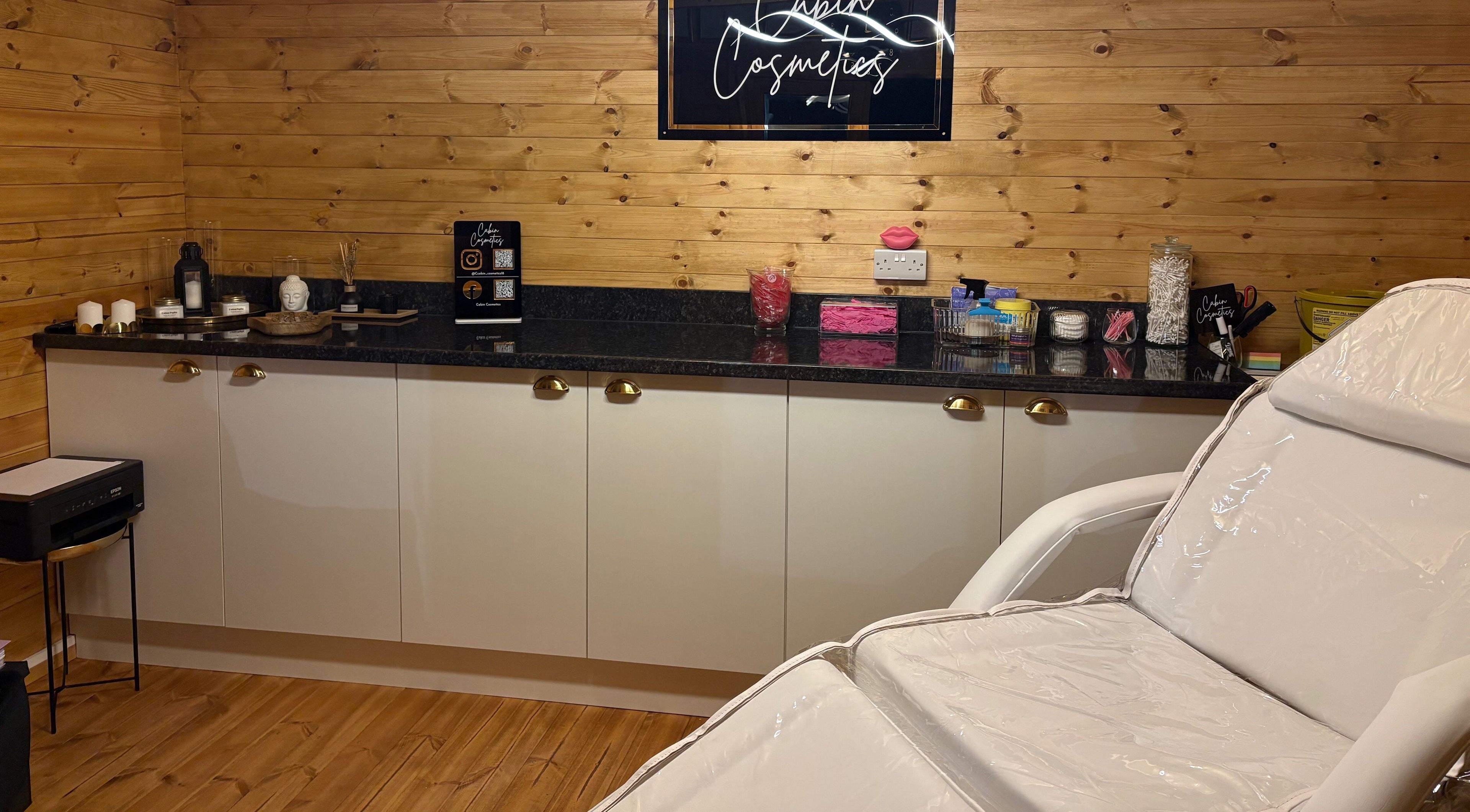 Cozy interior of Cabin Cosmetics in Verwood, England, GB showcasing a relaxing beauty treatment room.