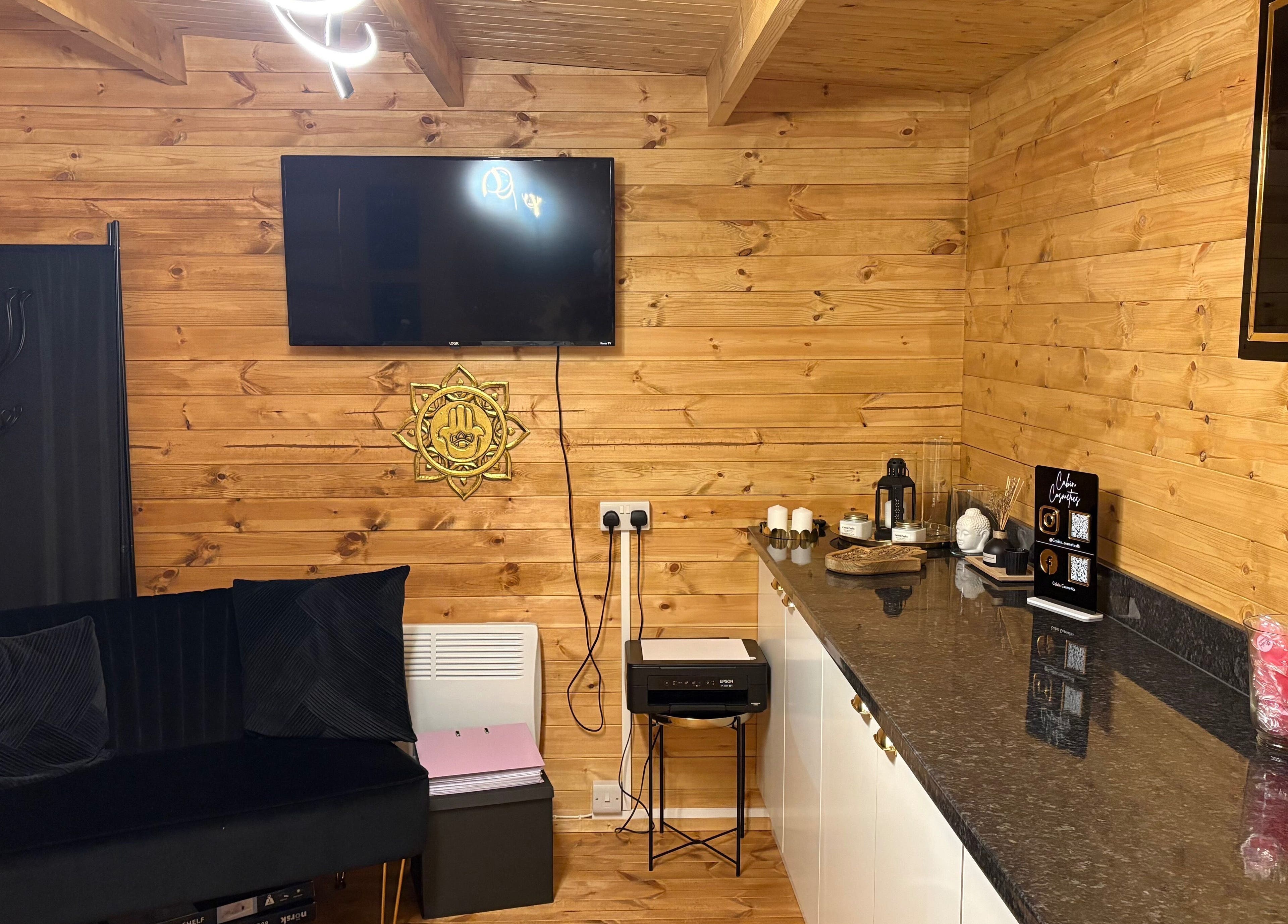 Rustic interior of Cabin Cosmetics in Verwood, England, GB with wooden walls and elegant decor.